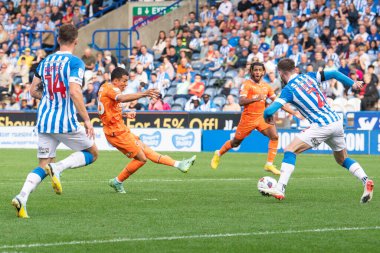 Ian Poveda #26 of Blackpool shoots on goal during the Sky Bet Championship match Huddersfield Town vs Blackpool at John Smith's Stadium, Huddersfield, United Kingdom, 4th September 202