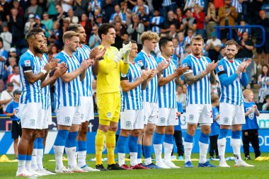 Players of Huddersfield Town have a minutes applause in memory of Eleanor Haigh during the Sky Bet Championship match Huddersfield Town vs Blackpool at John Smith's Stadium, Huddersfield, United Kingdom, 4th September 202