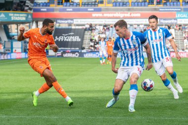 CJ Hamilton #22 of Blackpool crosses the ball during the Sky Bet Championship match Huddersfield Town vs Blackpool at John Smith's Stadium, Huddersfield, United Kingdom, 4th September 202