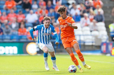 Oliver Turton #2 of Huddersfield Town and Theo Corbeanu #25 of Blackpool during the Sky Bet Championship match Huddersfield Town vs Blackpool at John Smith's Stadium, Huddersfield, United Kingdom, 4th September 202