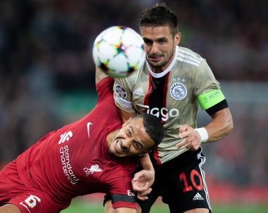Dusan Tadic #10 of Ajax and Thiago Alcantara #6 of Liverpool challenge for the ball during the UEFA Champions League match Liverpool vs Ajax at Anfield, Liverpool, United Kingdom, 13th September 202 clipart