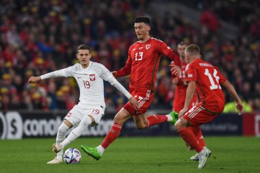 Polonyalı Sebastian Szymanski, 25 Eylül 202 tarihinde Cardiff City Stadyumu 'nda Galler ve Polonya arasında oynanan UEFA Milletler Ligi Grubu A4 karşılaşmasında eylem halindeydi.