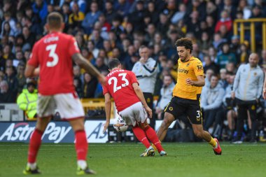 Wolverhampton Wanderers 'dan Rayan At-Nouri 15 Ekim 2022' de İngiltere 'nin Wolverhampton Ormanı' nda oynanan Premier League maçı sırasında Nottingham Ormanı 'nın 23 numaralı Remo Freuler' ı yendi.