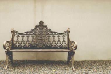 Steel Long Chair with Plaster Wall Background in the Garden