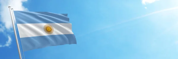 Argentina flag in the blue sky. Horizontal panoramic banner.