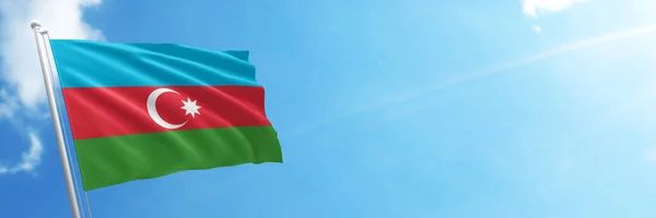 Azerbaijan flag in the blue sky. Horizontal panoramic banner.