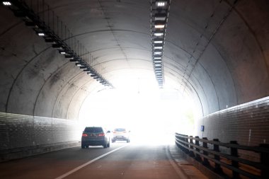 a vertical view of highway tunnel in the fog