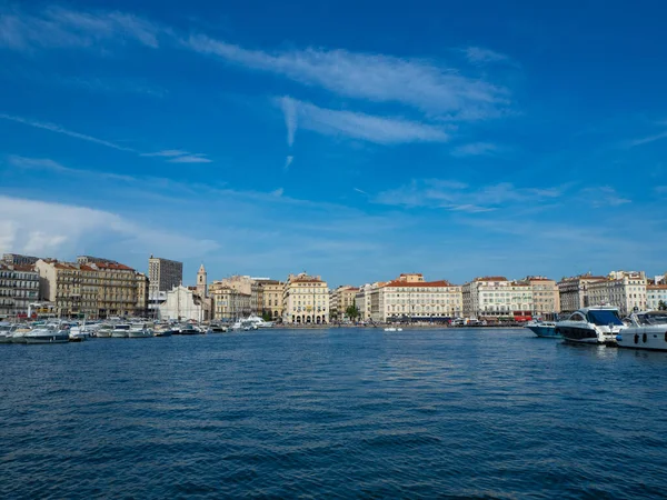 Marseille, France, is famous for its old harbour. View of the waterfront with historic buildings in front of Eglise Saint-Ferreol les Augustins when crossing the old harbour.