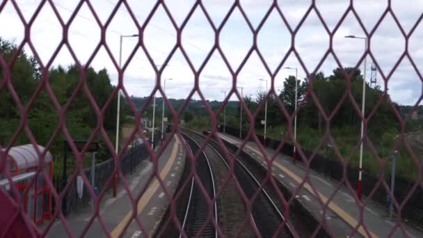 View of empty railway station through fence — Stock Video