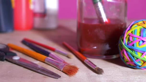 Paint brushes and craft supplies — Stock Video