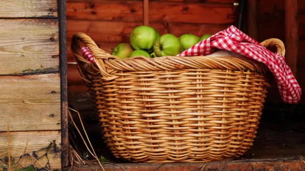 Basket of fresh baking apples in a rustic shed — Stock Video