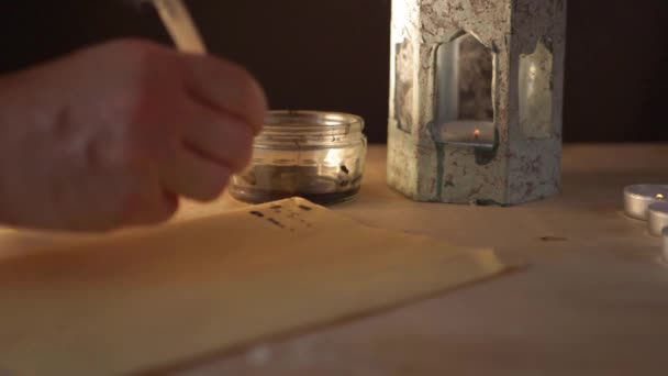 Hand finishes writing old parchment document with feather quill — Stockvideo