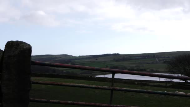 View of Holmfirth countryside in England Yorkshire through view of gate — Stock video