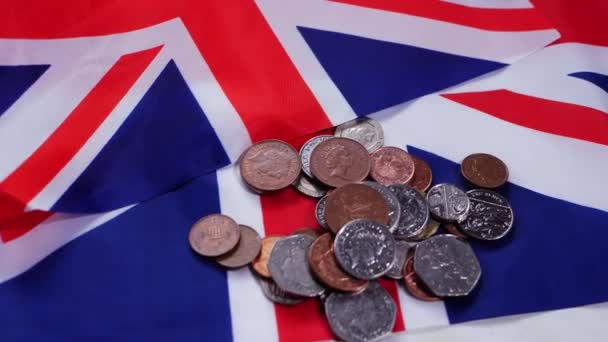 Loose change British money in coins with Union Jack flag — Stock Video