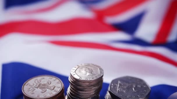 Loose change British money in coins with Union Jack flag — Stock Video