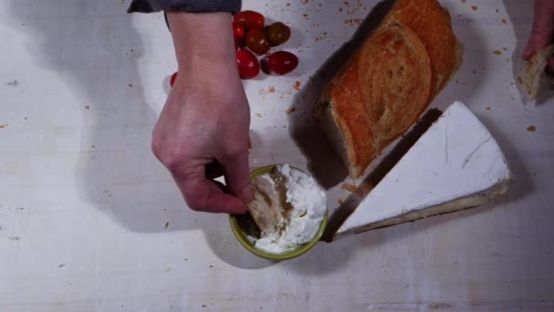 Dipping bread into bowl of cottage cheese curds and whey — Stock Video