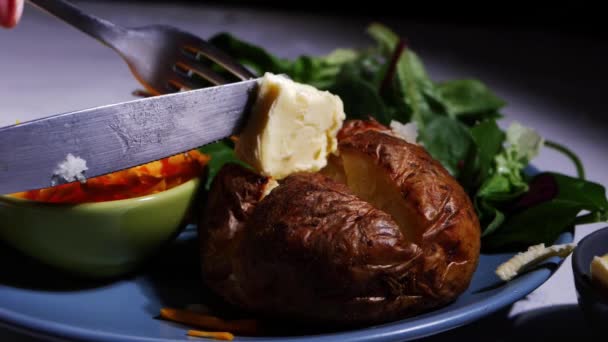 Serving butter and baked jacket potato — Stock Video