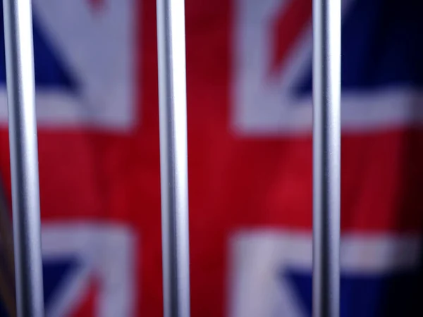 Więzienne kraty z brytyjską flagą Union Jack — Zdjęcie stockowe