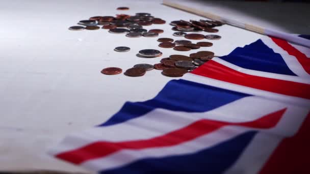 Loose change British money in coins with Union Jack flag — Stock Video