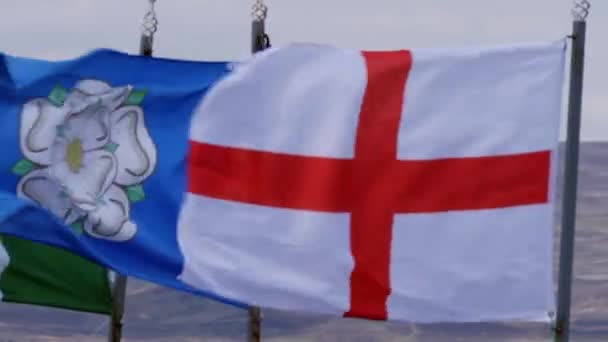 Flags of Yorkshire and England blow on windy day — ストック動画