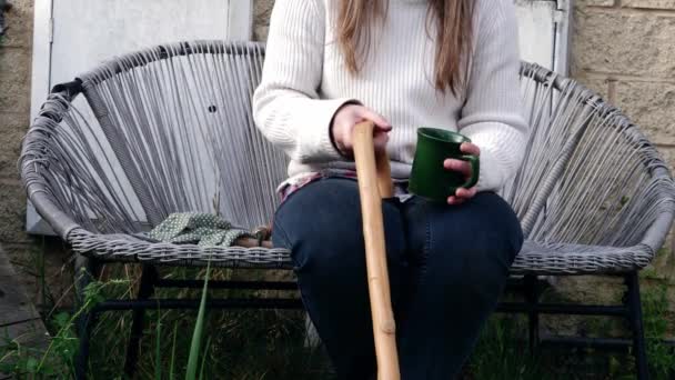 Woman Holding Wooden Walking Stick Stands Medium Shot Slow Motion — Stockvideo
