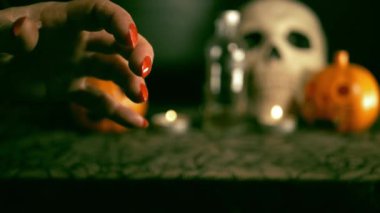 Evil witch hands in Halloween background close up shot slow motion selective focus