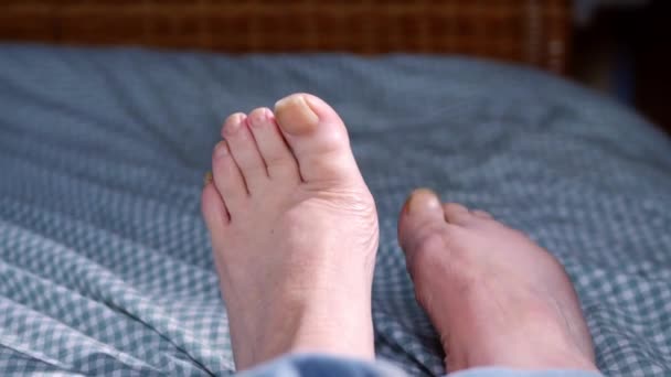 Feet Relaxing Bed Duvet Medium Shot Selective Focus — Video