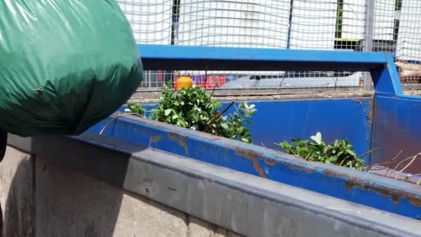 Man Emptying Garbage Waste Landfill Crate Medium Slow Motion Shot — Stok Video