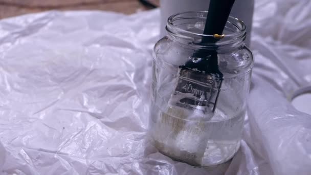 Paint Brush Jar Turpentine Medium Panning Hand Held Slow Motion — Stockvideo