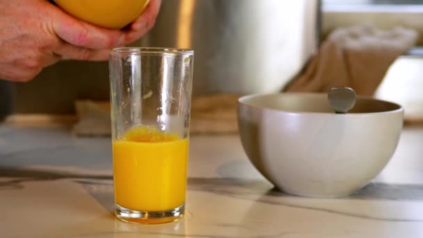 Pouring Glass Fresh Orange Juice Breakfast Medium Shot Selective Focus — Vídeo de Stock