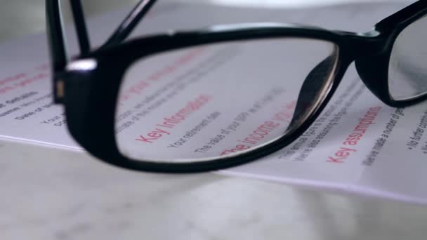 Pension Statement View Glasses Close Dolly Shot Selective Focus — 图库视频影像