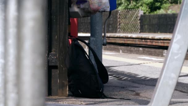 Suspicious Rucksack Left Railway Platform Wide Shot Slow Motion Selective — Vídeo de stock