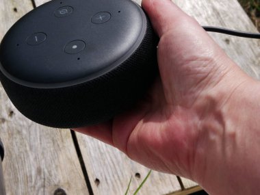 Home smart voice device in hand medium selective focus