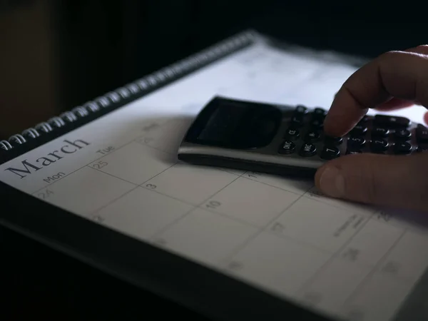 Hands Using Calculator March Calendar Medium Shot Selective Focus — 스톡 사진