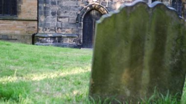 Old stone gothic church in England reveal shot 4k wide dolly selective focus