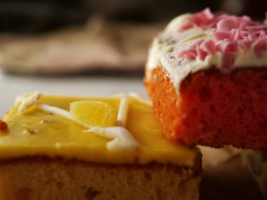Selection of decorated homemade cakes close up shot selective focus