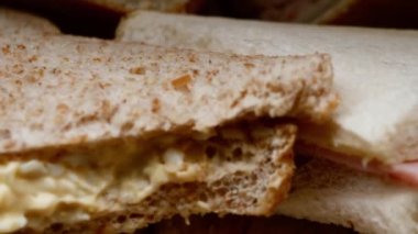 Selection of sandwiches with choice of fillings close up dolly shot slow motion selective focus