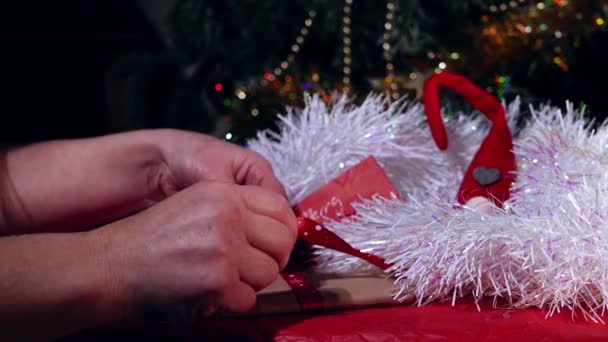 Hands Wrapping Christmas Gift Medium Dolly Shot Slow Motion Selective — Stok video