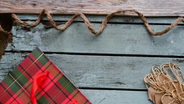 Christmas Background Gift Bag Tags Distressed Wood Background Medium Overhead — Stock videók