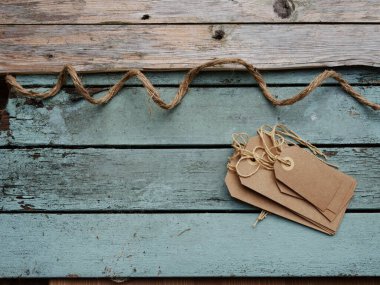 Address label tags on distressed wooden background wooden background medium overhead shot selective focus