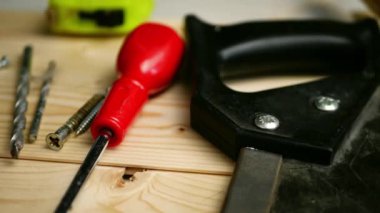 Carpenter tools for woodwork on wooden background close up panning shot medium selective focus