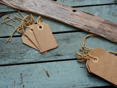 Address label tags on distressed wooden background medium overhead shot selective focus