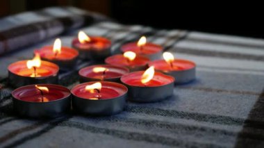 Pink tealight candles medium 4k slow motion shot selective focus