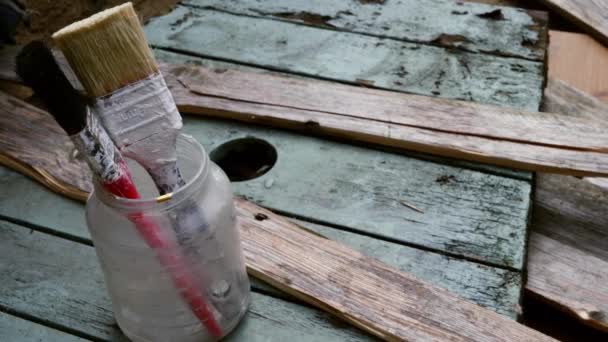 Paint Brushes Decorating Wooden Background Dolly Shot Slow Motion Shot — Stockvideo