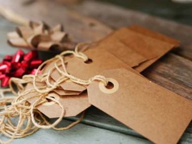 Christmas gift tags with bows close up selective focus