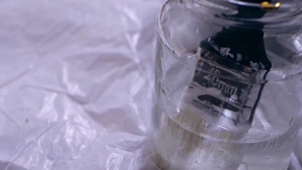 Paint Brush Jar Turpentine Medium Panning Hand Held Slow Motion — Stock video