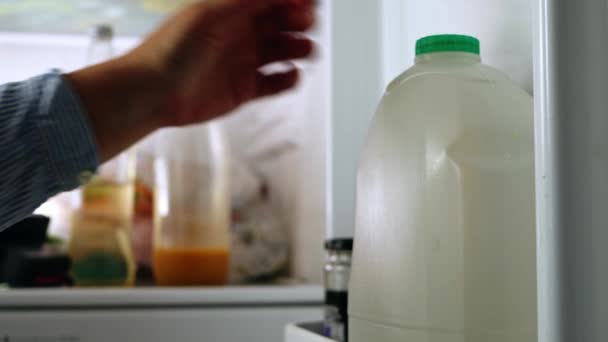 Hand Reaches Bottle Milk Refrigerator Medium Shot Selective Focus — Video Stock