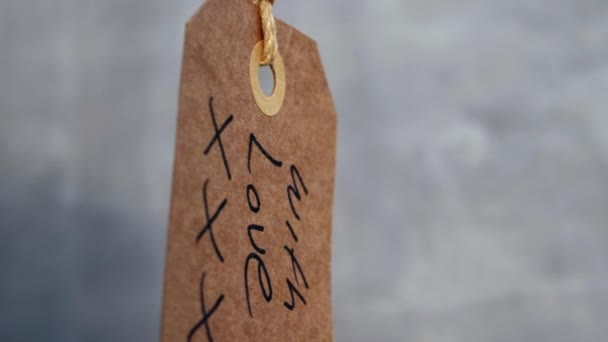 Love Handwritten Message Gift Gray Background Medium Shot Selective Focus — Stok Video