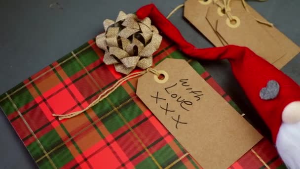 Christmas Background Gift Bag Tags Gray Background Medium Overhead Shot – stockvideo