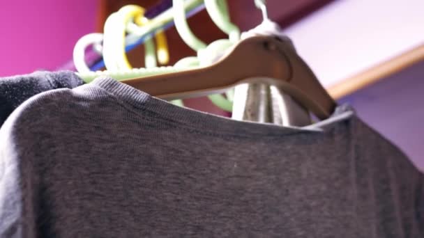 Clothes Hung Rail Medium Zoom Shot Slow Motion Selective Focus — Vídeo de Stock